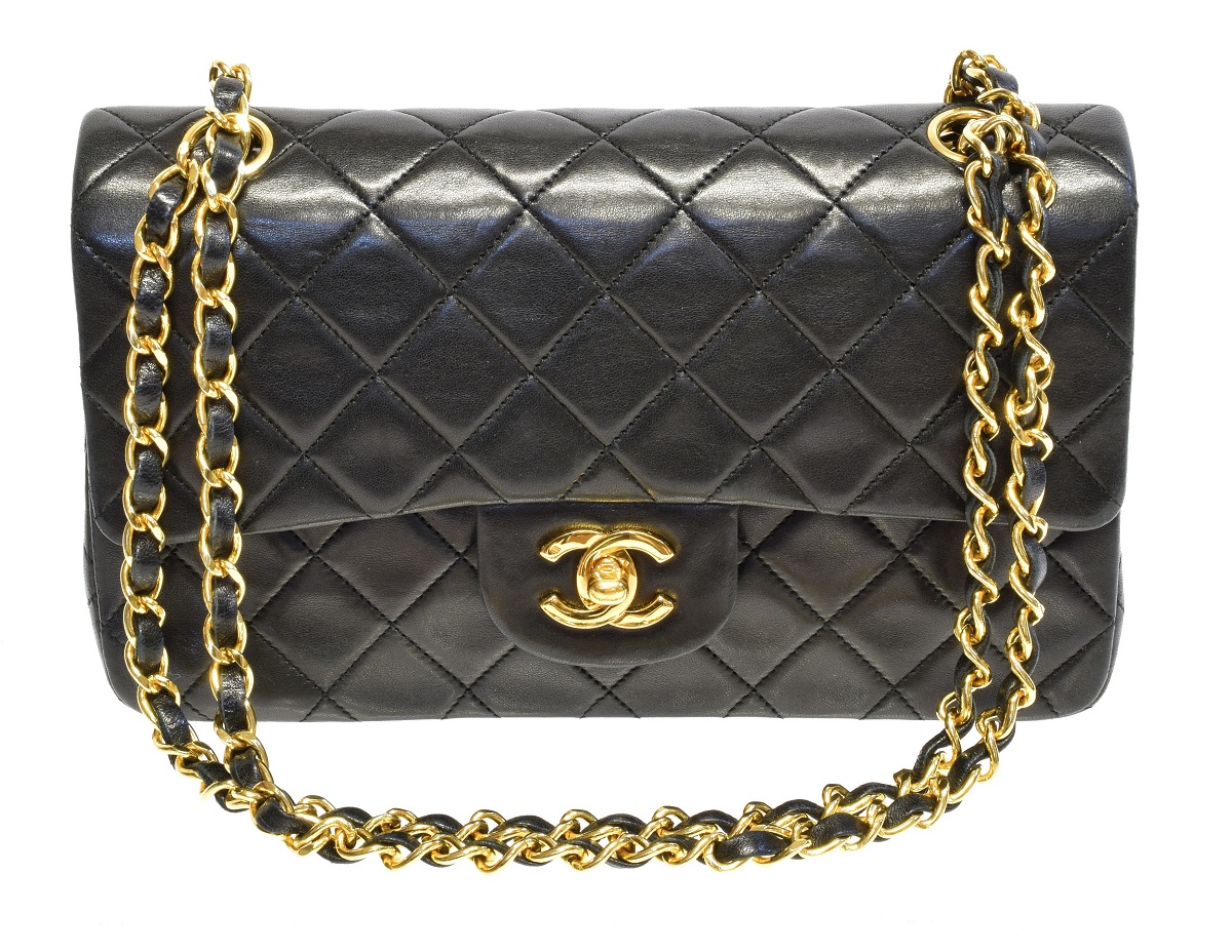 A Chanel Classic Double Flap Bag, circa 1989-91, the black quilted leather exterior with gold-tone hardware and chain handles, serial no. 1601799, with maker's authenticity card.  23x15x6.8cm  Sold for £3,538